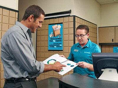 Associate showing printed catalog example